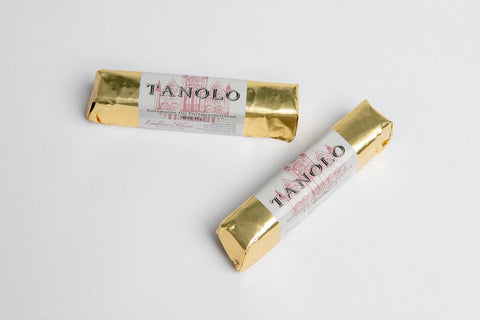 Tanolo, Nougat-Riegel überzogen mit feiner weißer Schokolade zwei Reigel nebeneinander